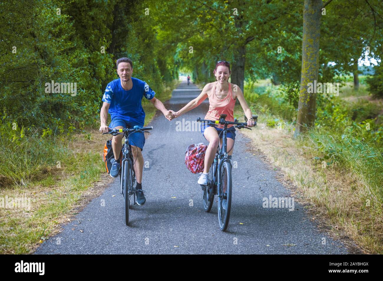 Man, woman, couple, cyclist, head-on Stock Photo