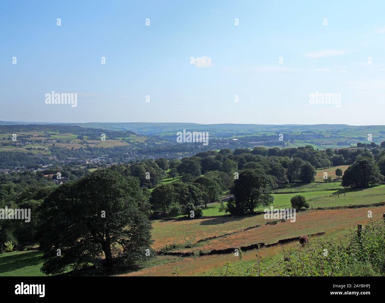a scenic view of west yorkshire countryside with the town of sowerby visible at the bottom of the ca Stock Photo