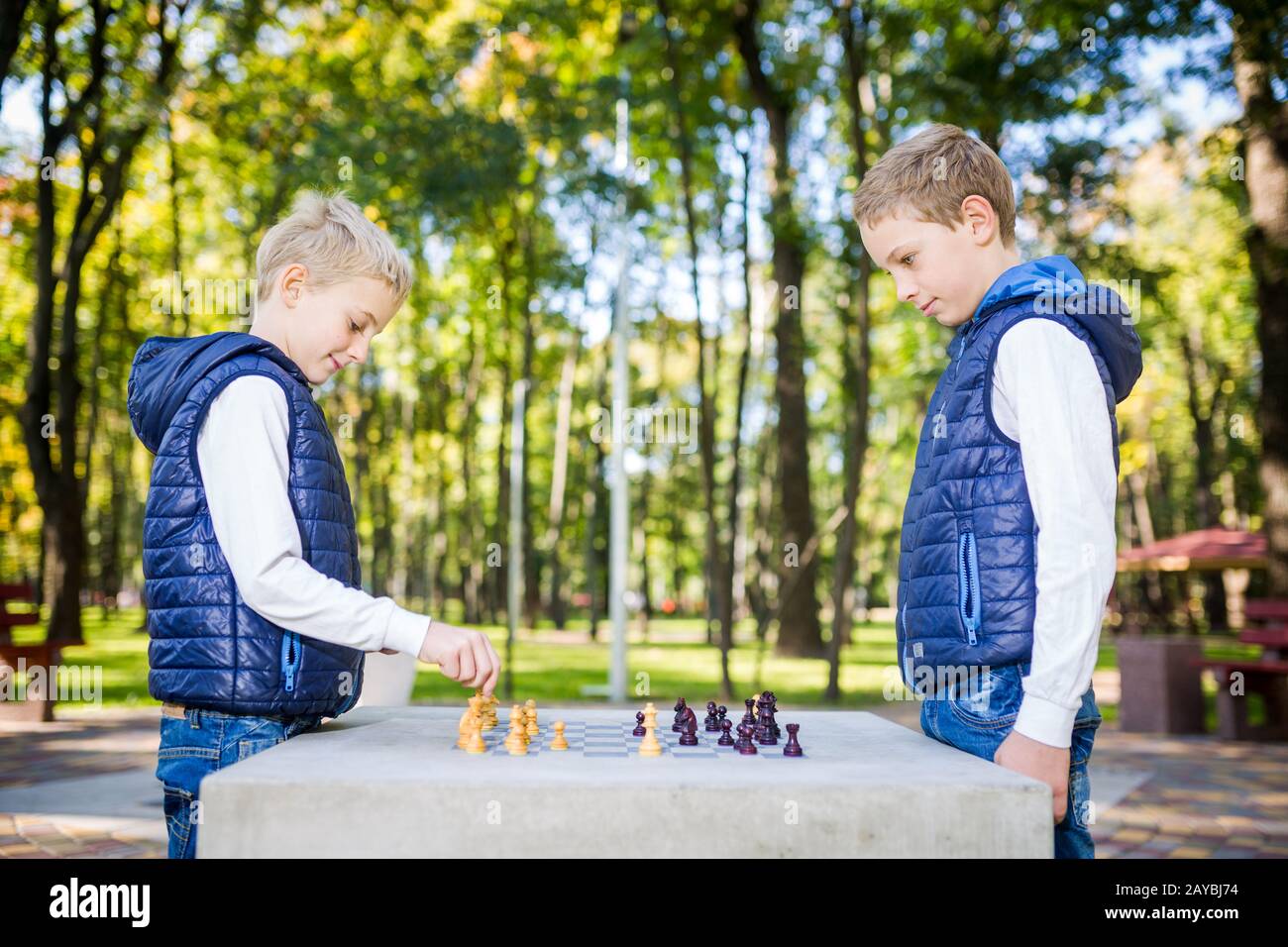 The topic is children learning, logical development, mind math, miscalculation moves advance. Big family two brothers Caucasian Stock Photo