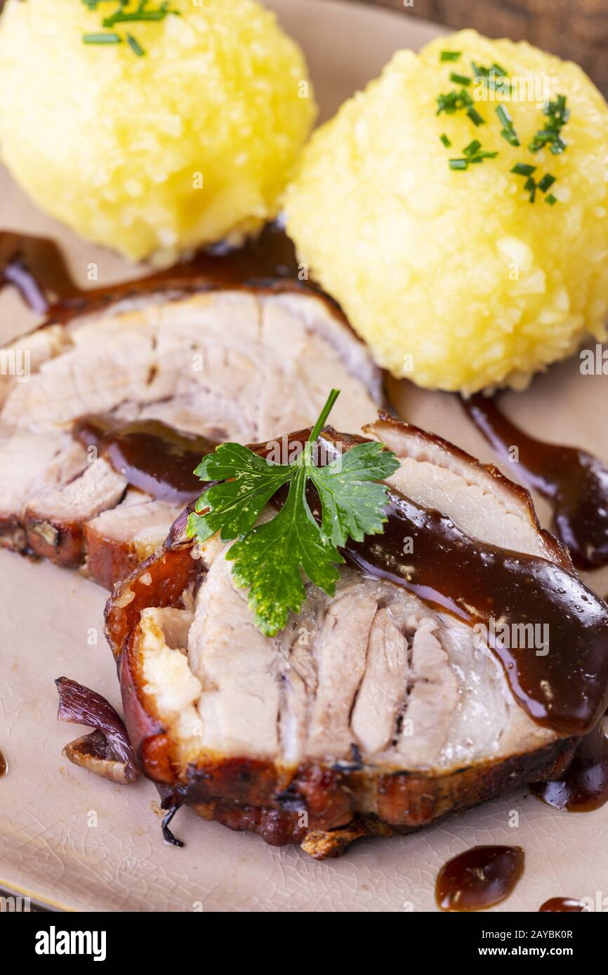 Bavarian roast pork with potato dumpling Stock Photo Alamy