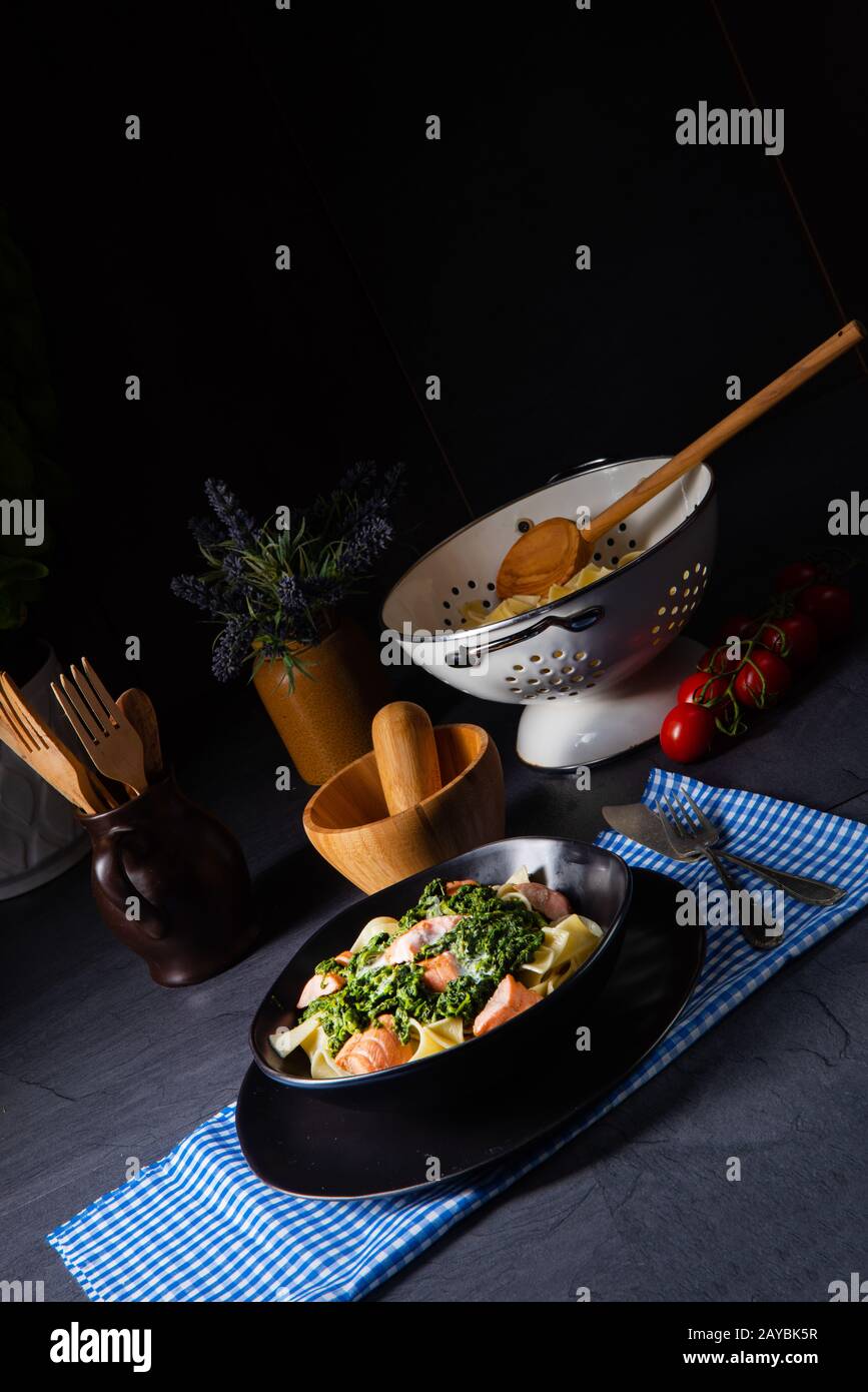 pappardelle pasta with creamed spinach and fried salmon Stock Photo Alamy