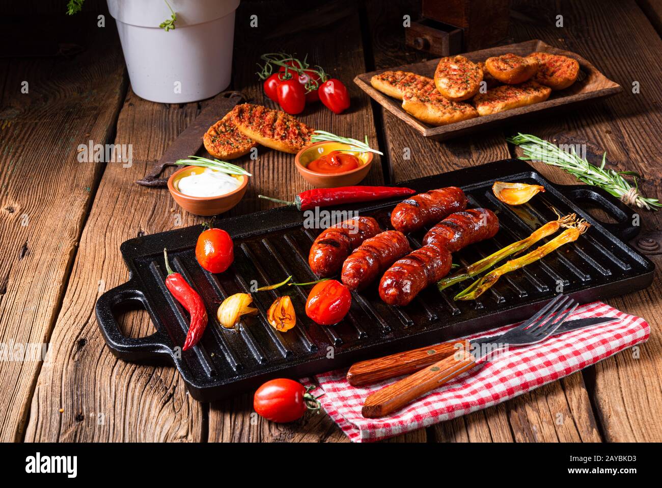 Chili chorizo sausage with tomato bruschetta Stock Photo - Alamy