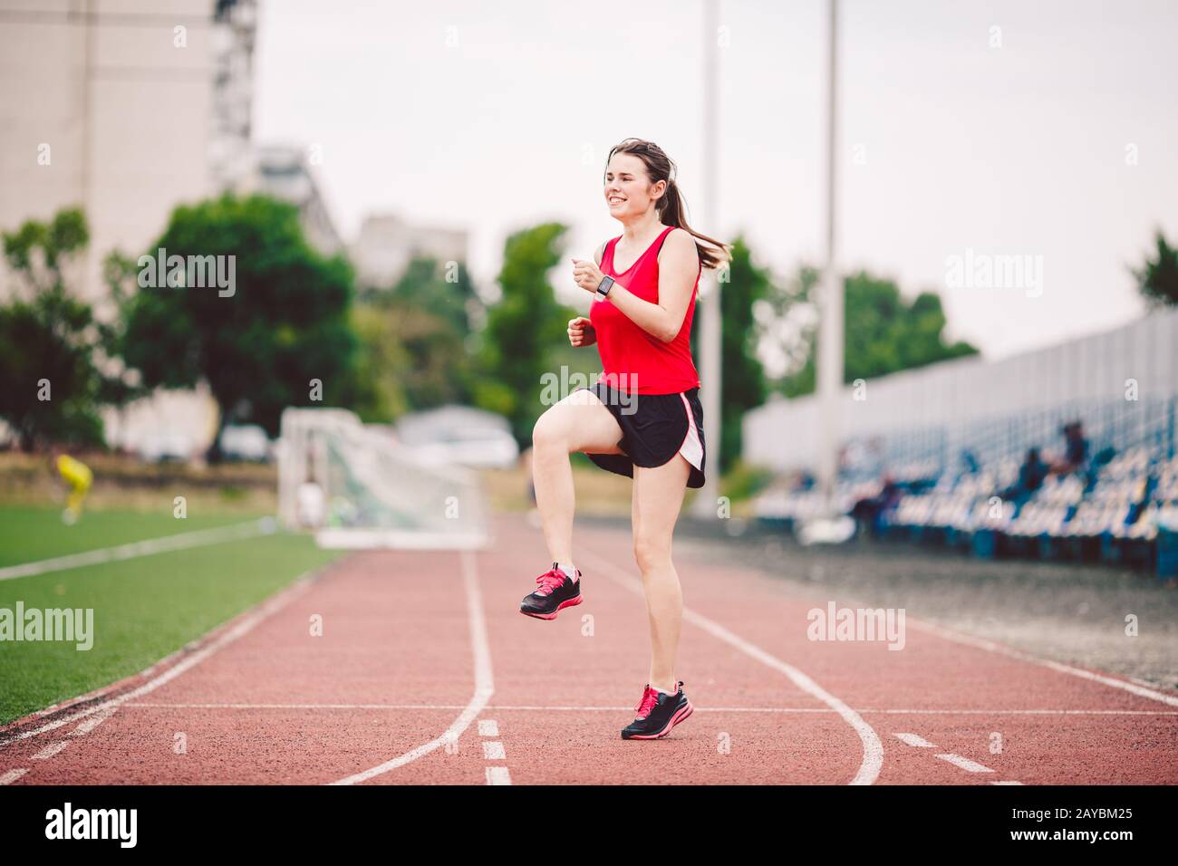 Female athlete preparing legs for cardio workout. Fitness runner doing