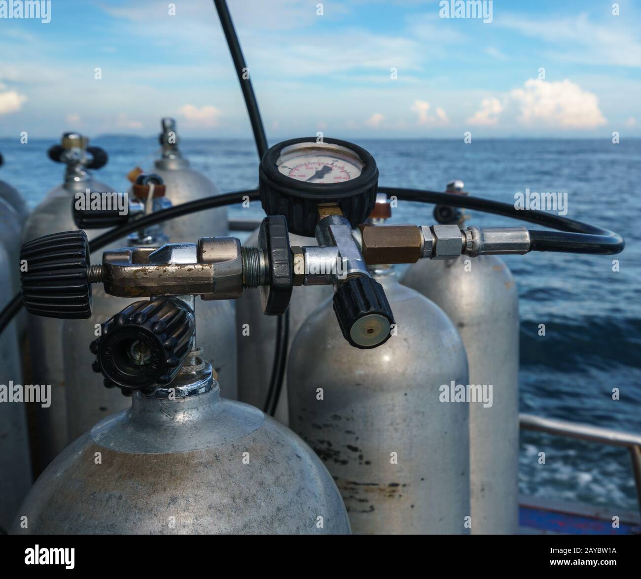 Diving equipment. Gas cylinders on sea backdrop Stock Photo Alamy