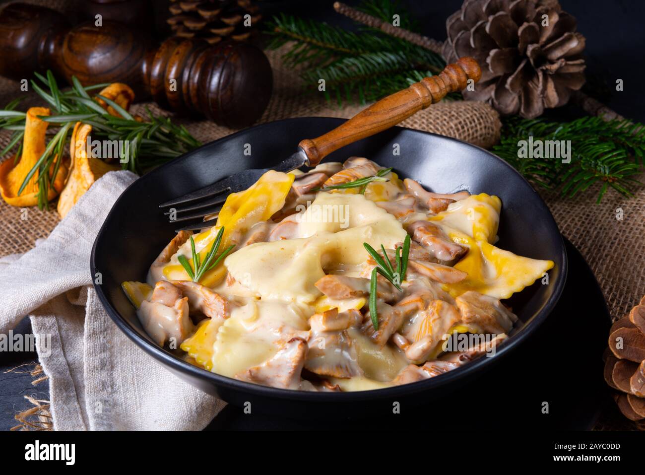 Colorful farfalle pasta with chanterelles and cream sauce Stock Photo