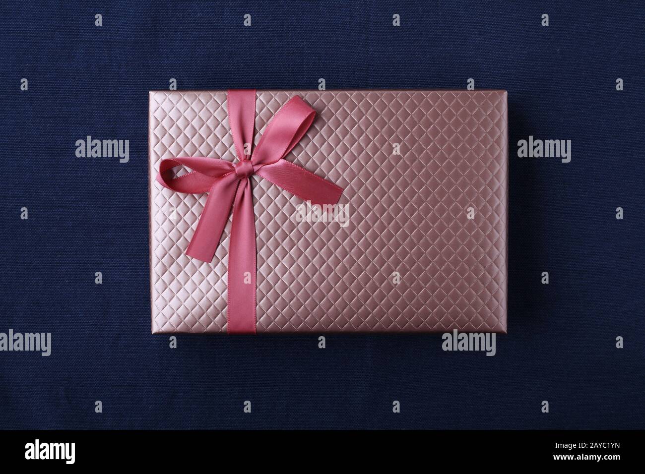 gift present box with ribbon isolated on table cloth Stock Photo