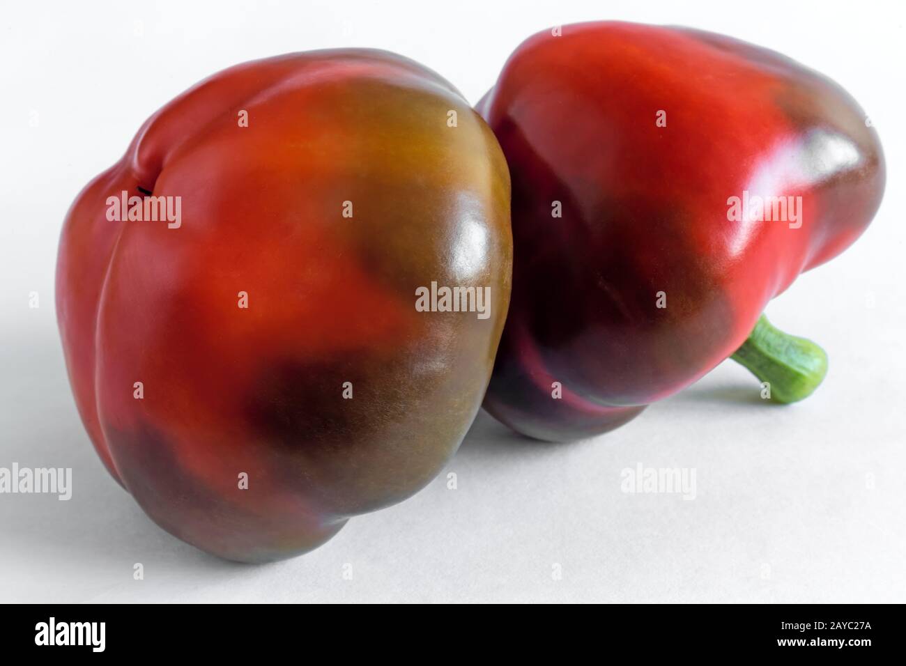 Two red peppers isolated on white background. Stock Photo