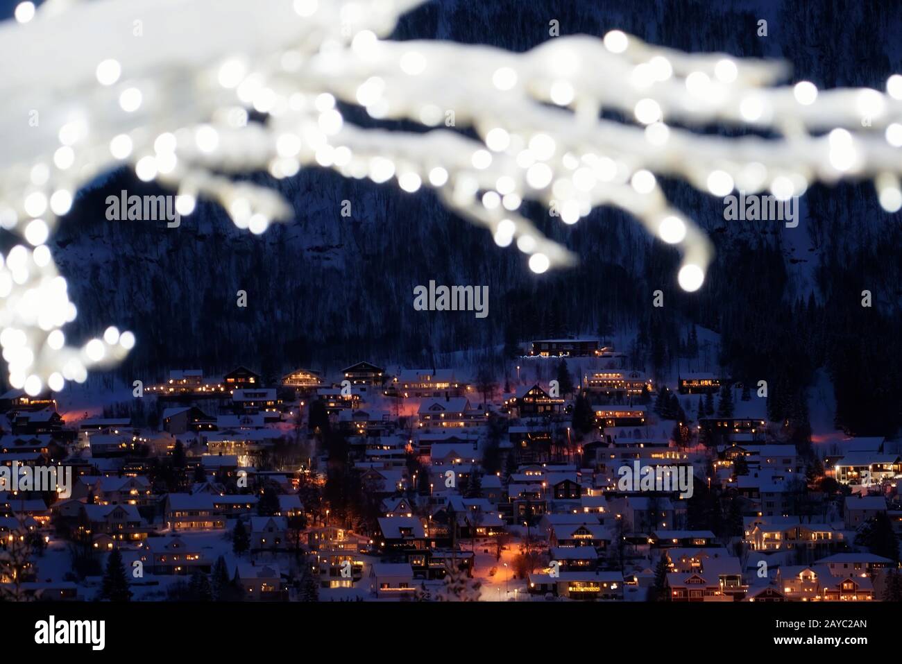 Defocused winter tree with lights and decorations Stock Photo