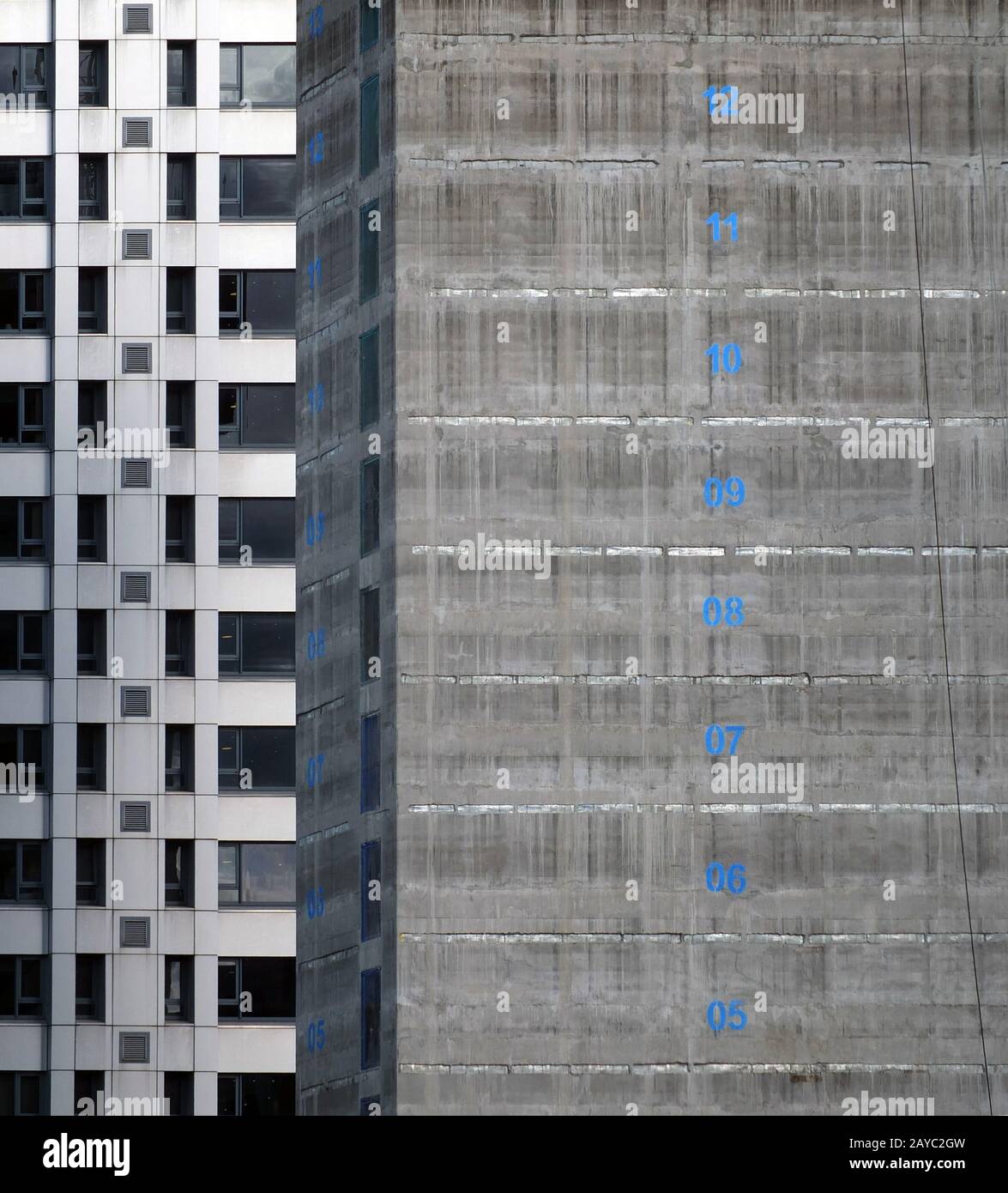 the concrete core of a tall apartment building under construction with