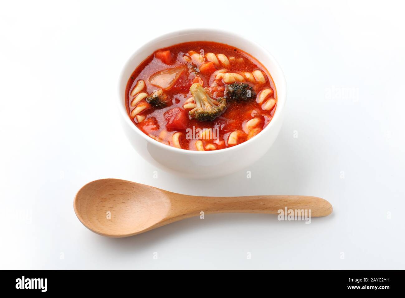 minestrone vegetables tomato soup with pasta closeup isolated on white background Stock Photo