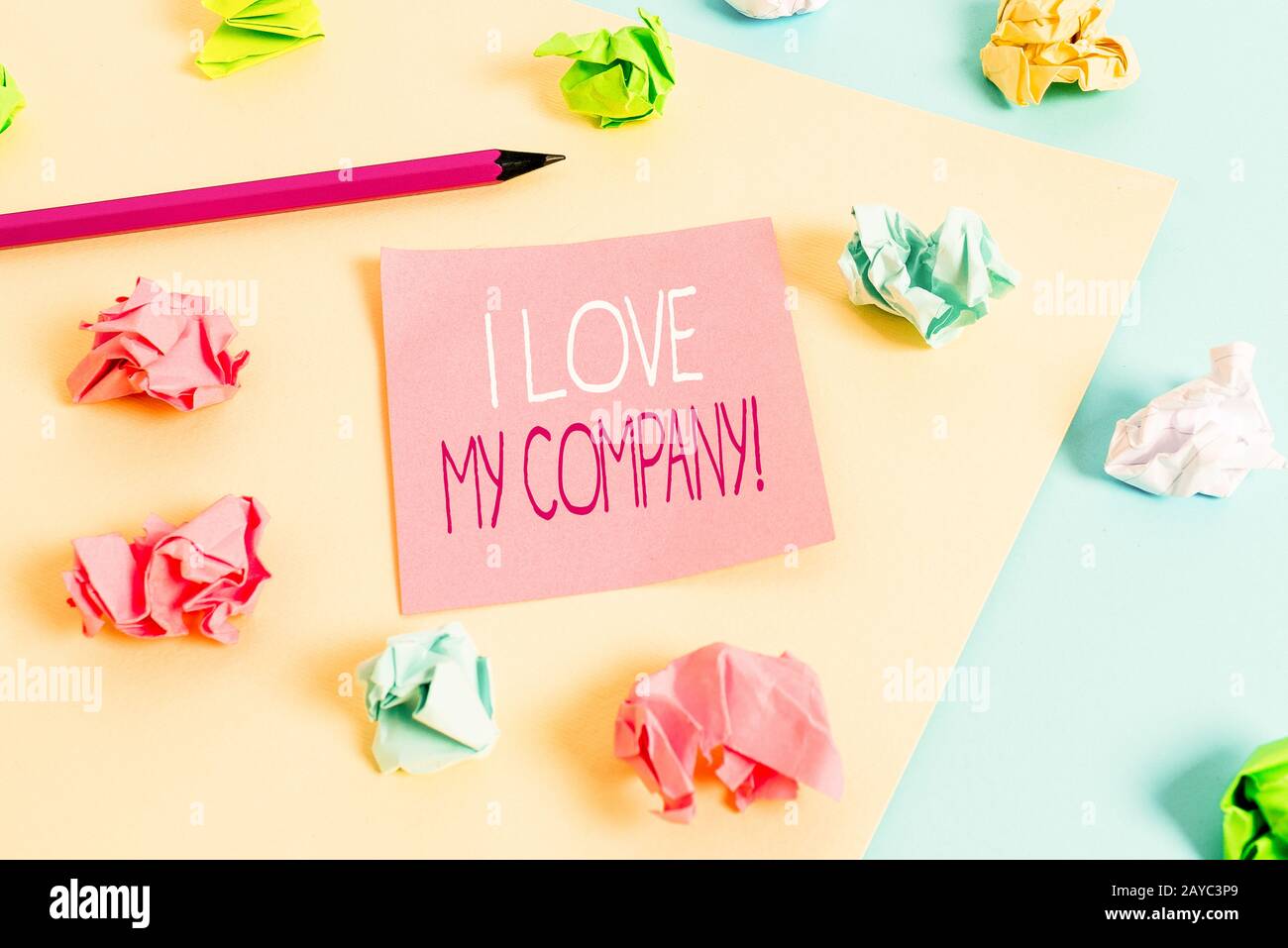 Writing note showing I Love My Company. Business photo showcasing tell why admire their job and workplace Colored crumpled paper Stock Photo