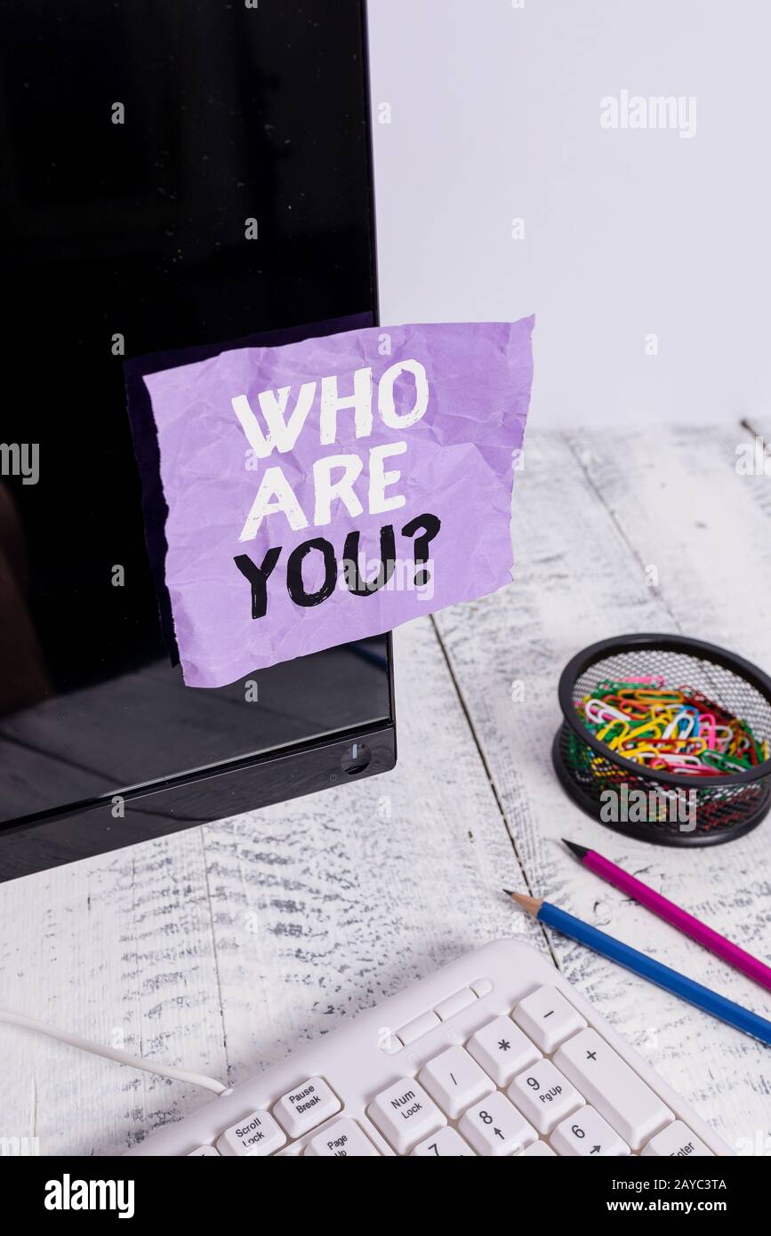 Word writing text Who Are Youquestion. Business concept for someone asking your demonstratingal background or history Note paper Stock Photo