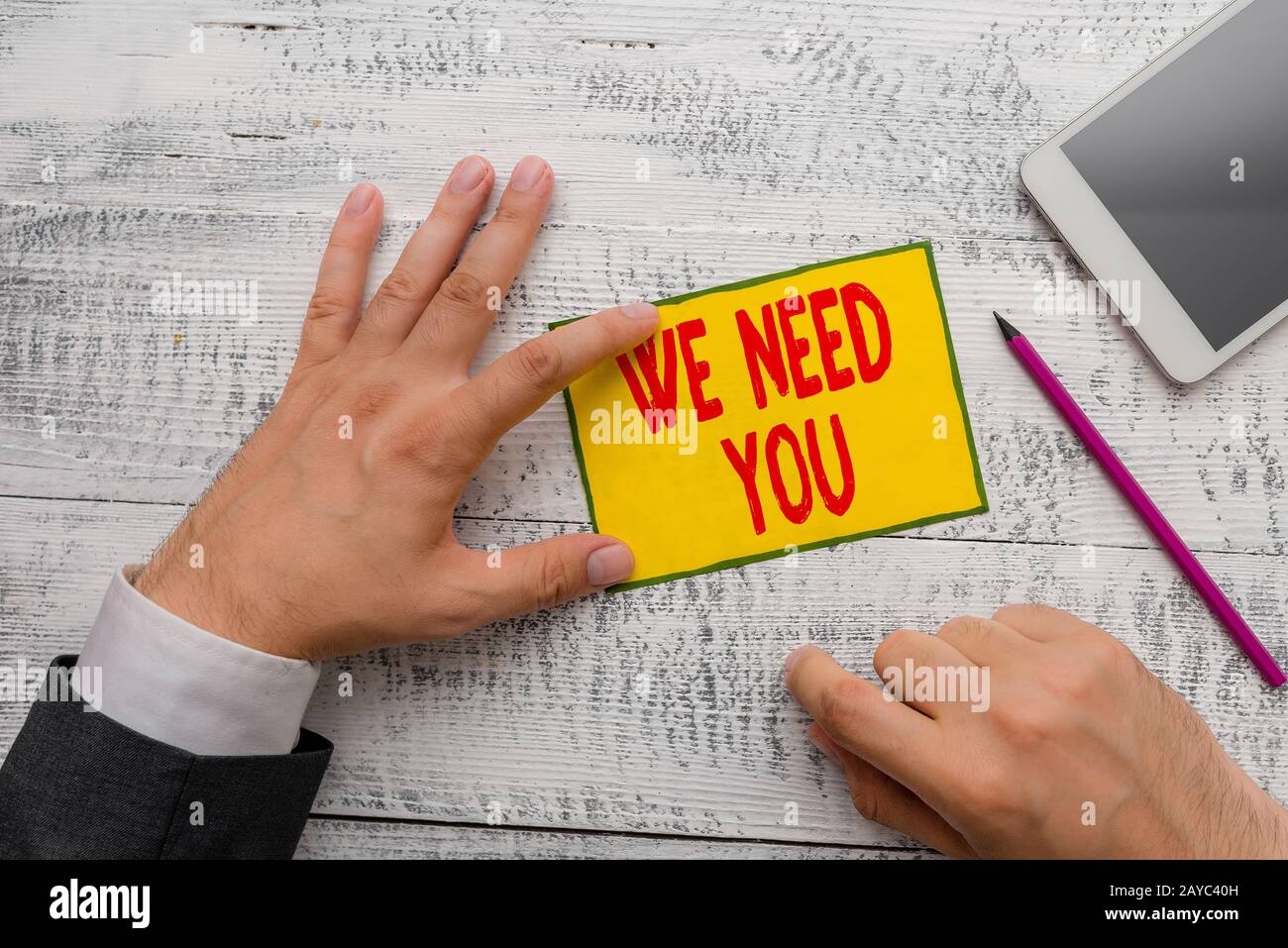 Handwriting text writing We Need You. Concept meaning to fulfill the needs of the assignment duty or obligation. Stock Photo