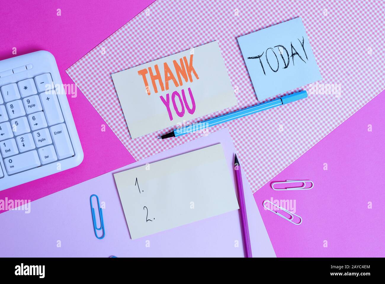 Handwriting text Thank You. Concept meaning a polite expression used when acknowledging a gift or service Writing equipments and Stock Photo