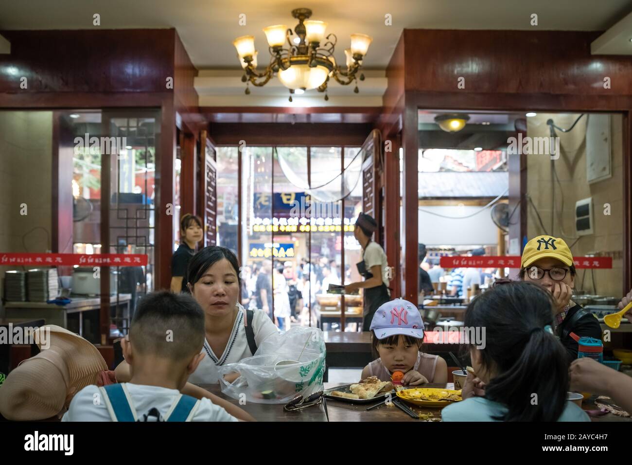 Chinese family dining in restaurant Stock Photo Alamy