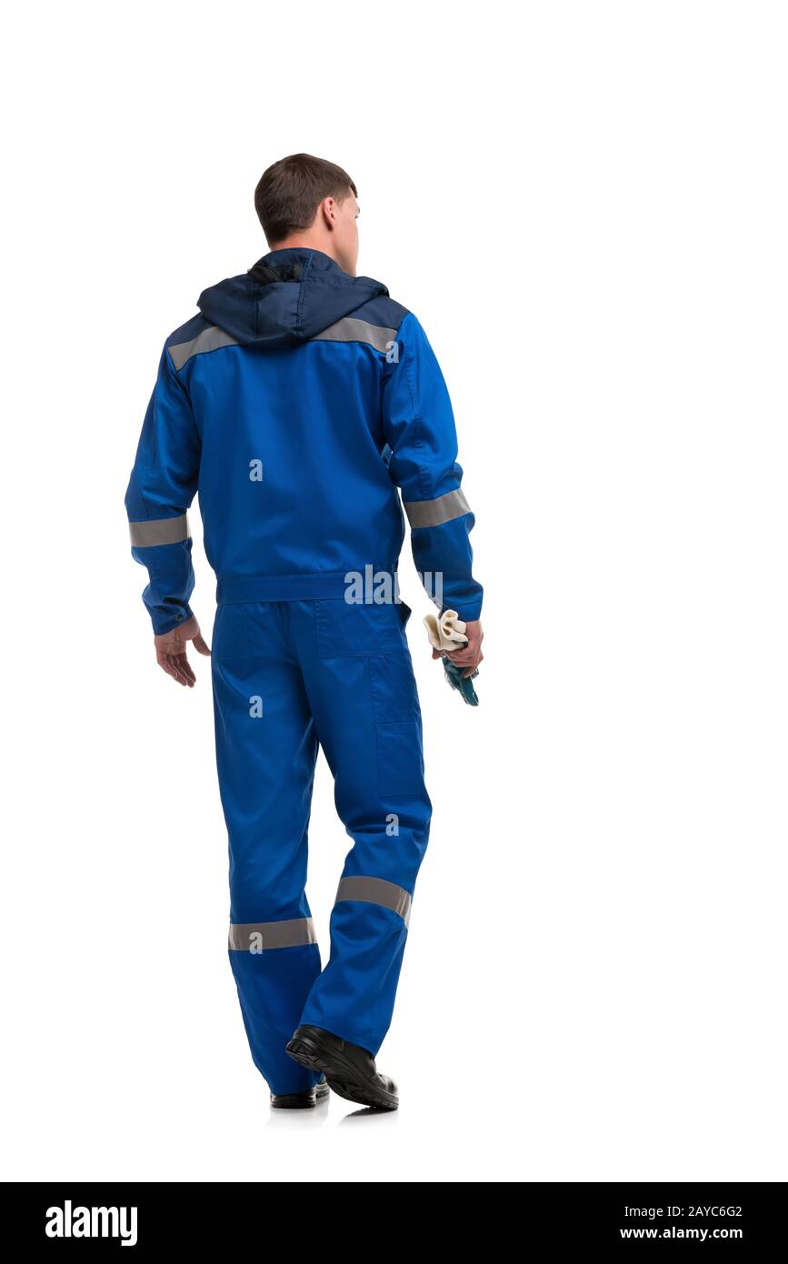 Man in blue work clothes isolated rearview Stock Photo Alamy