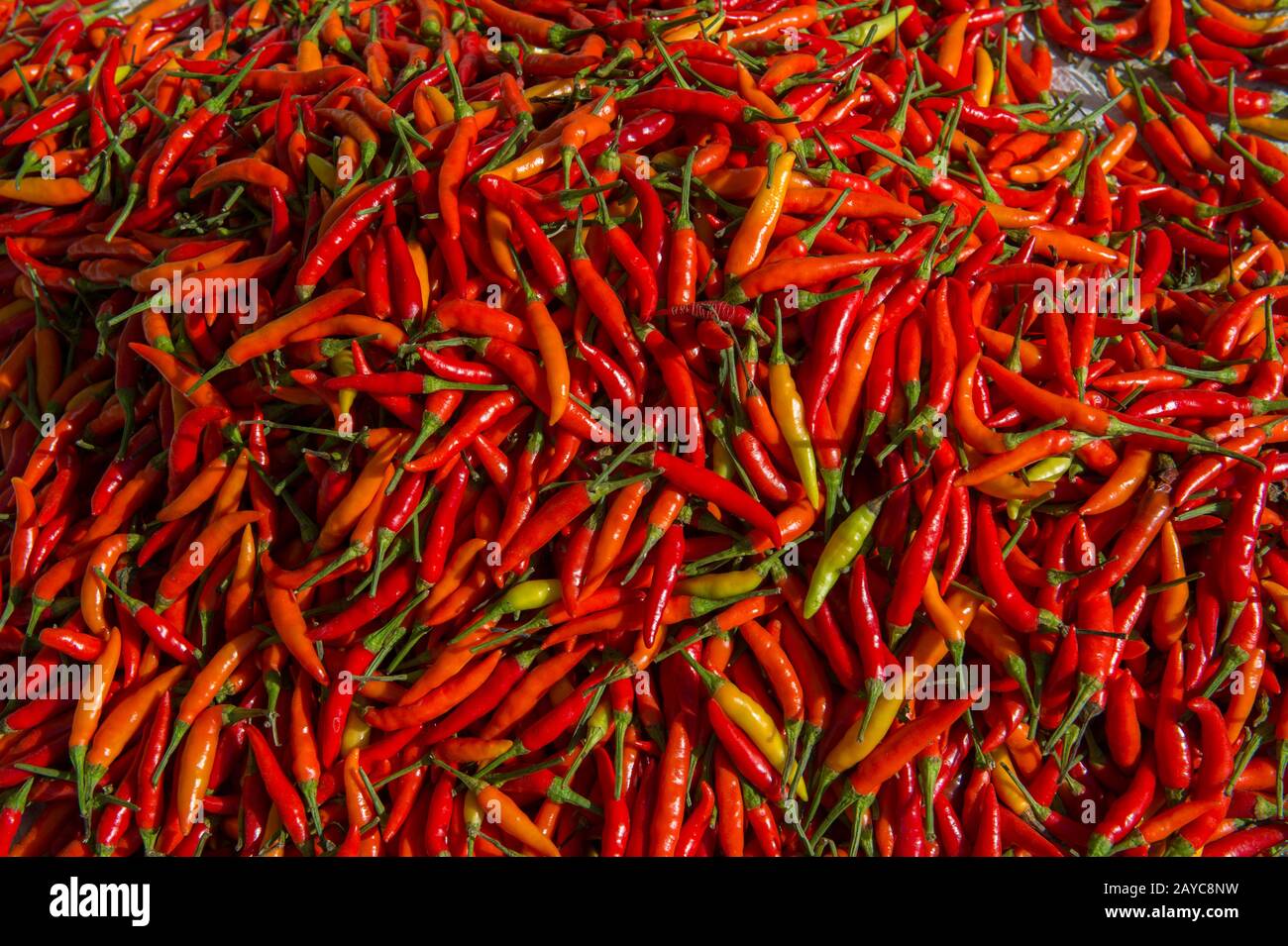 A Market Scene With Red Chili Peppers For Sale At The Market In Labuan Bajo A