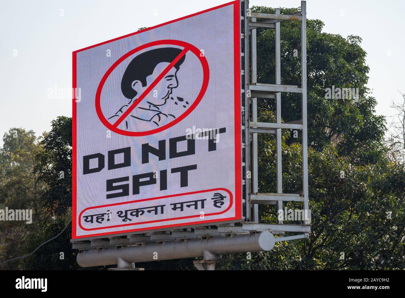 Attari, India - Febuary 8, 2020: Light up sign reminding tourists not to spit in the stadium (Do not spit) at the Wagah Border Closing ceremony with P Stock Photo