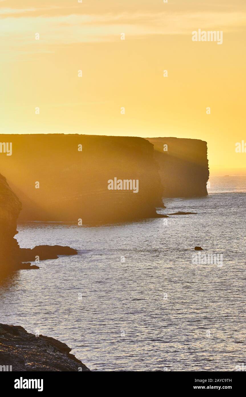 Cliffs of Kilkee in Ireland county Clare during sunset. Tourist destination Stock Photo