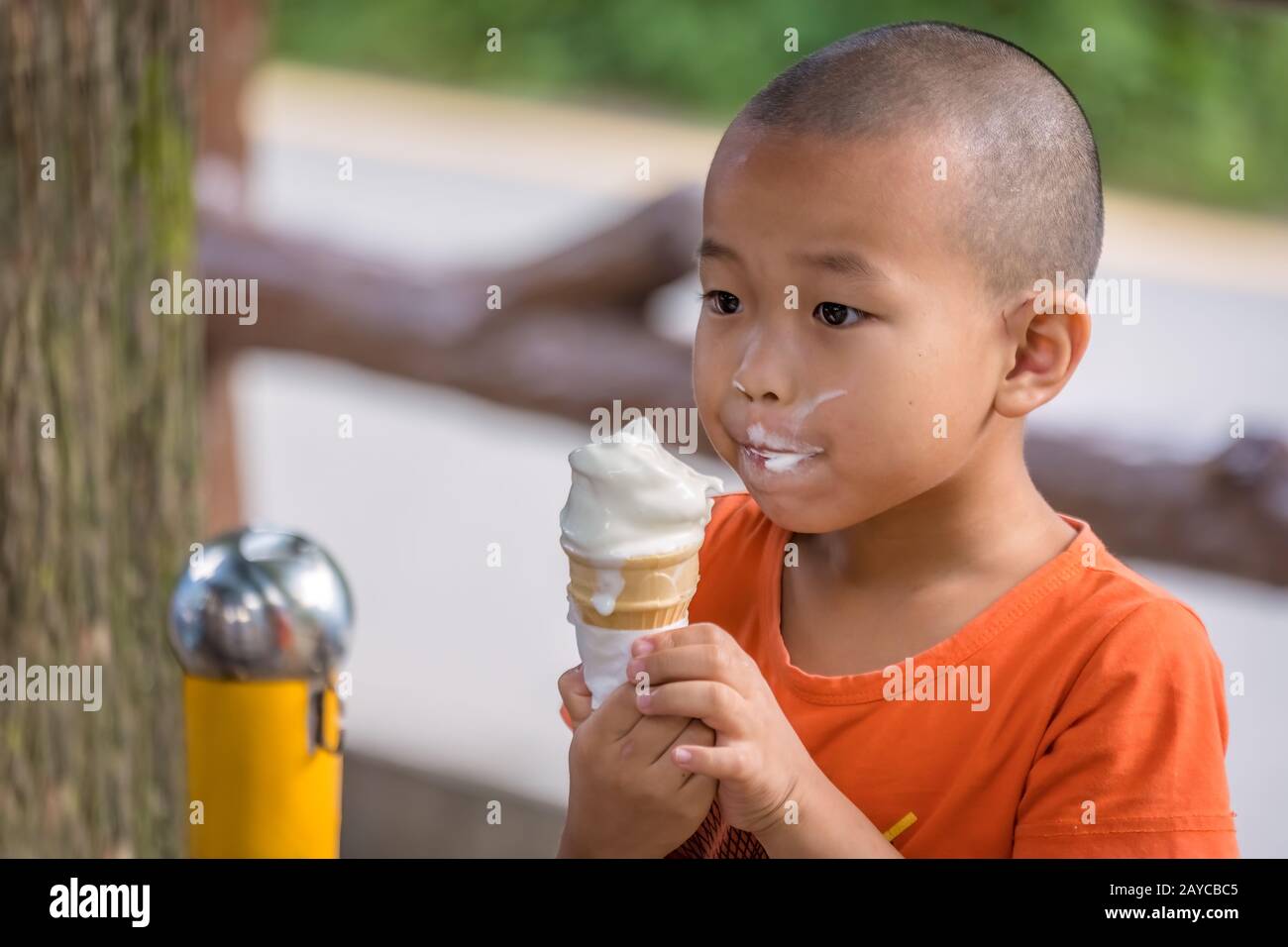 Boy eating ice cream walking hires stock photography and images Alamy