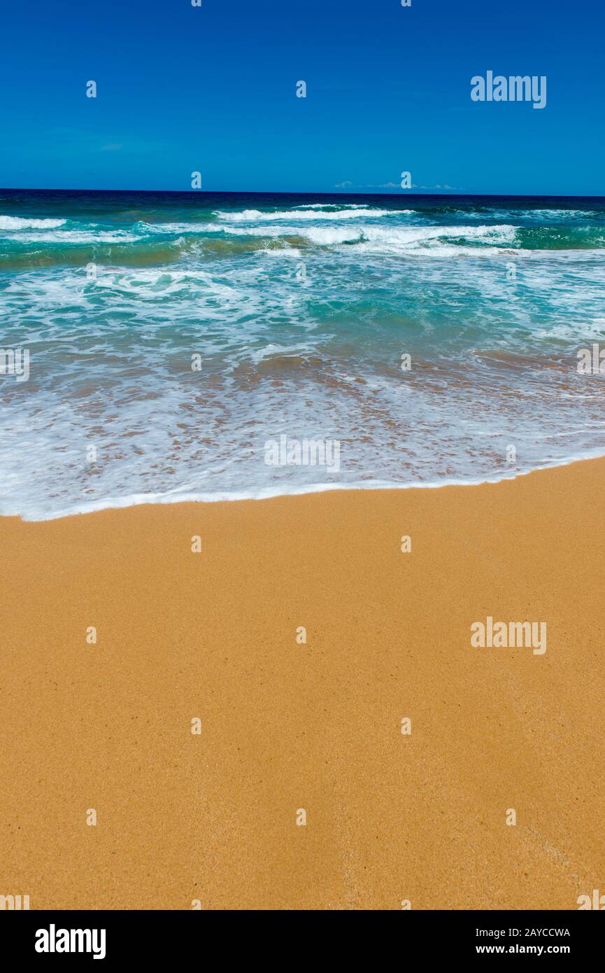 View of the white sand beach at Kealia Beach Park near Kaapa on the eastern side of the Hawaiian Island of Kauai, Hawaii, USA. Stock Photo