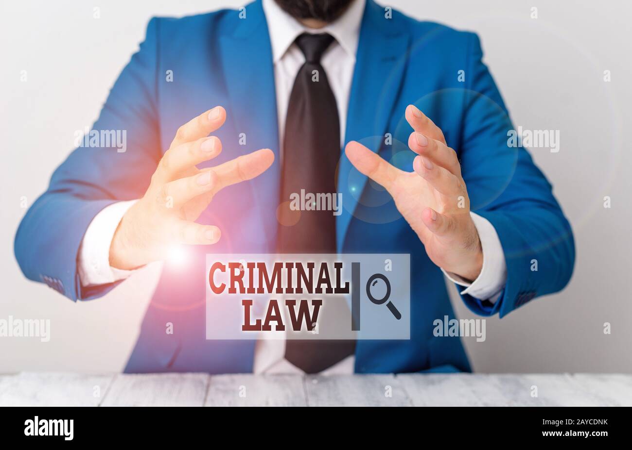 Handwriting text writing Criminal Law. Concept meaning legal system which relates to punishing those commits crime Man holds emp Stock Photo