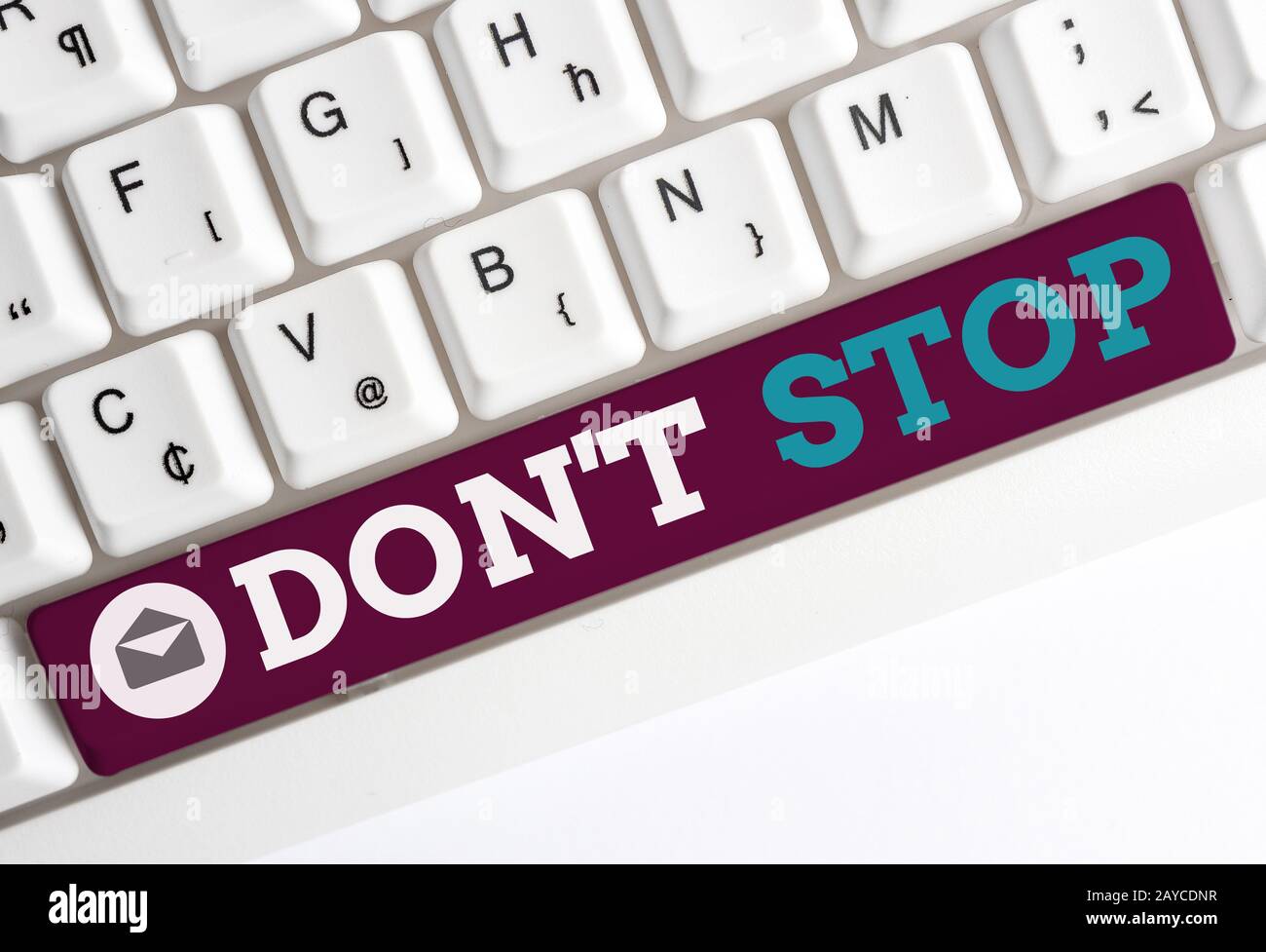 Conceptual hand writing showing Don T Stop. Business photo showcasing Continue what had been doing without rendering a delay Whi Stock Photo