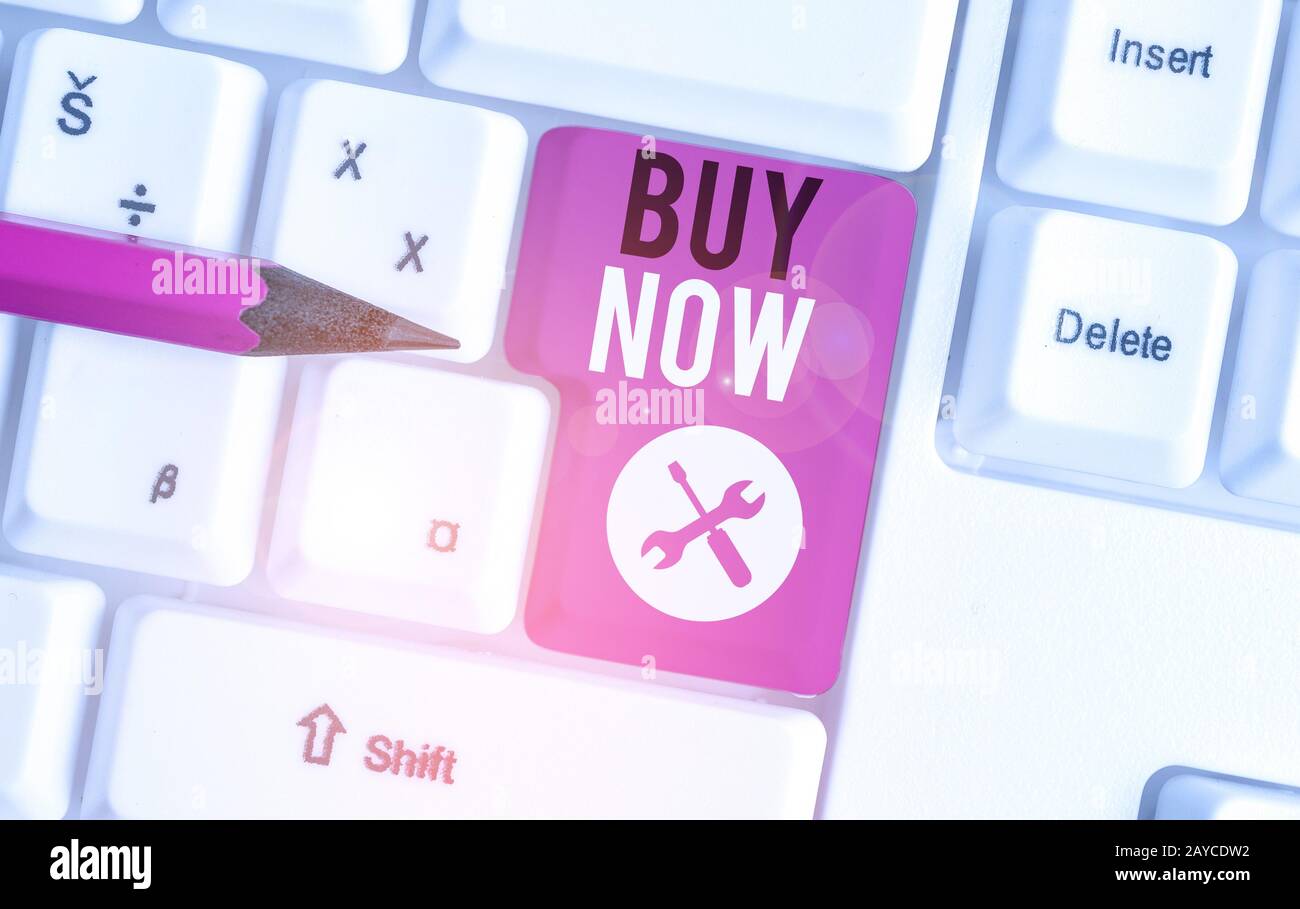 Text sign showing Buy Now. Conceptual photo asking someone to purchase your product Provide good Discount White pc keyboard with Stock Photo
