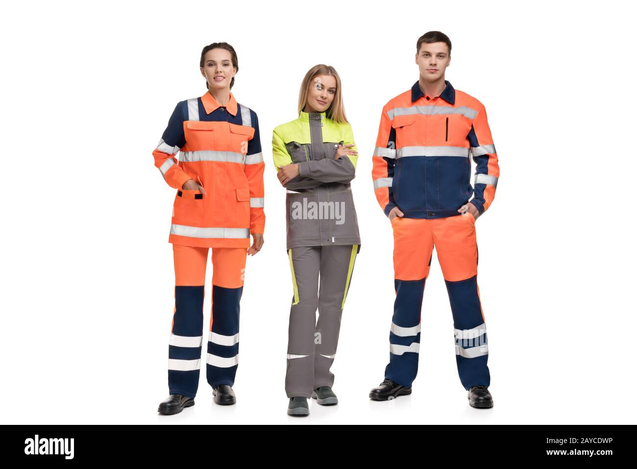 Handsome man and pretty women in work clothes view Stock Photo