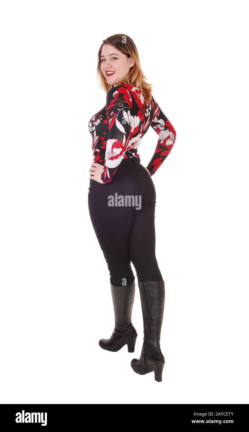 Beautiful woman standing in tights and boots Stock Photo - Alamy