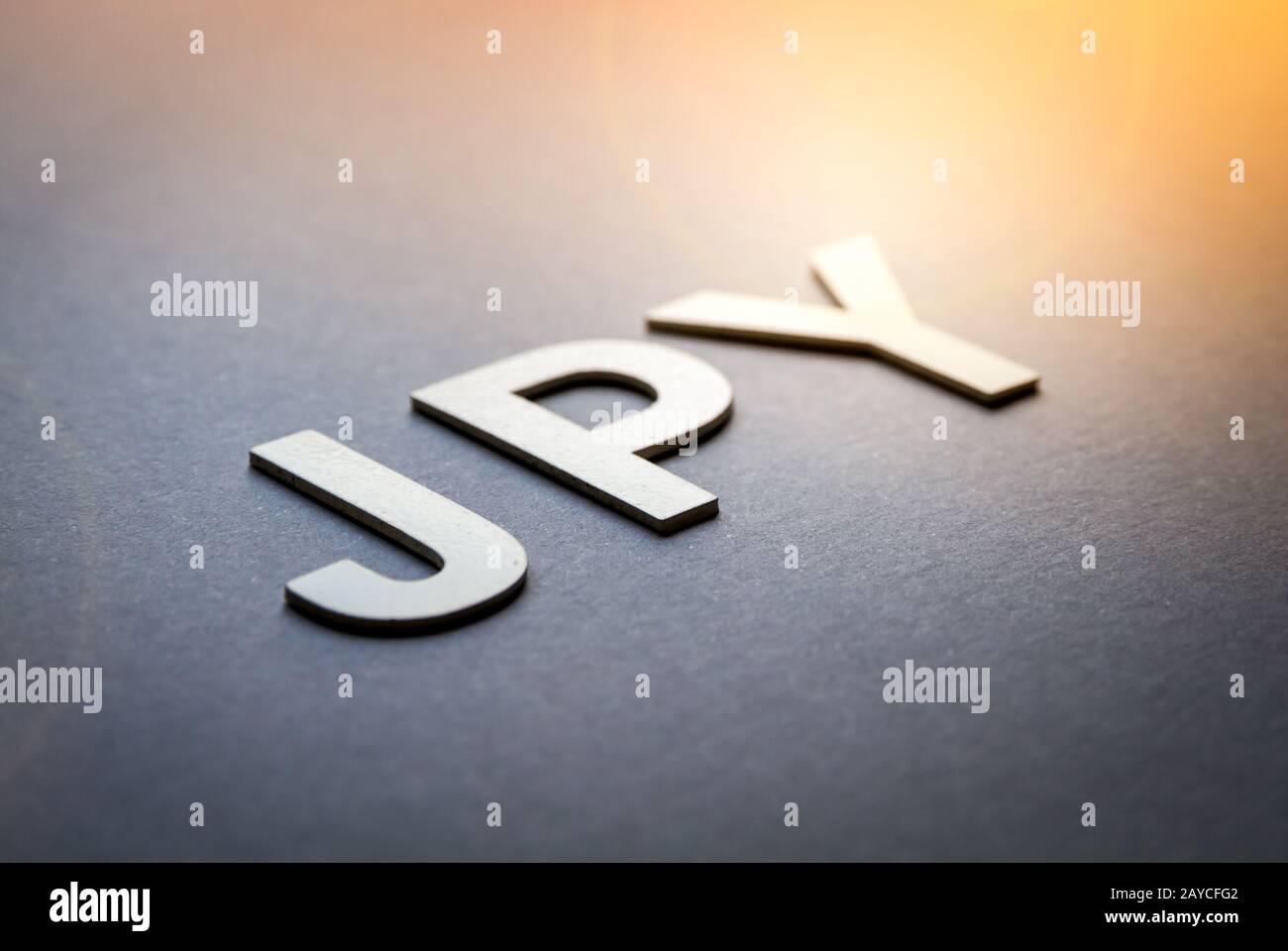 Word JPY written with white solid letters Stock Photo