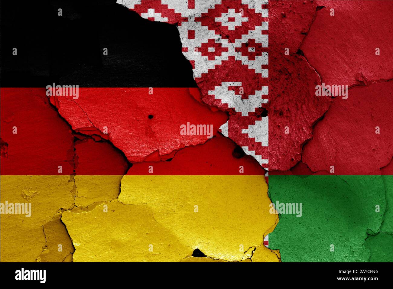 flags of Germany and Belarus painted on cracked wall Stock Photo