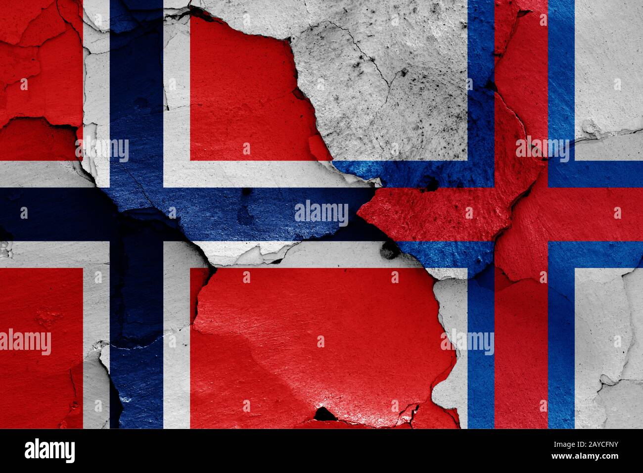 flags of Norway and Faroe Islands painted on cracked wall Stock Photo