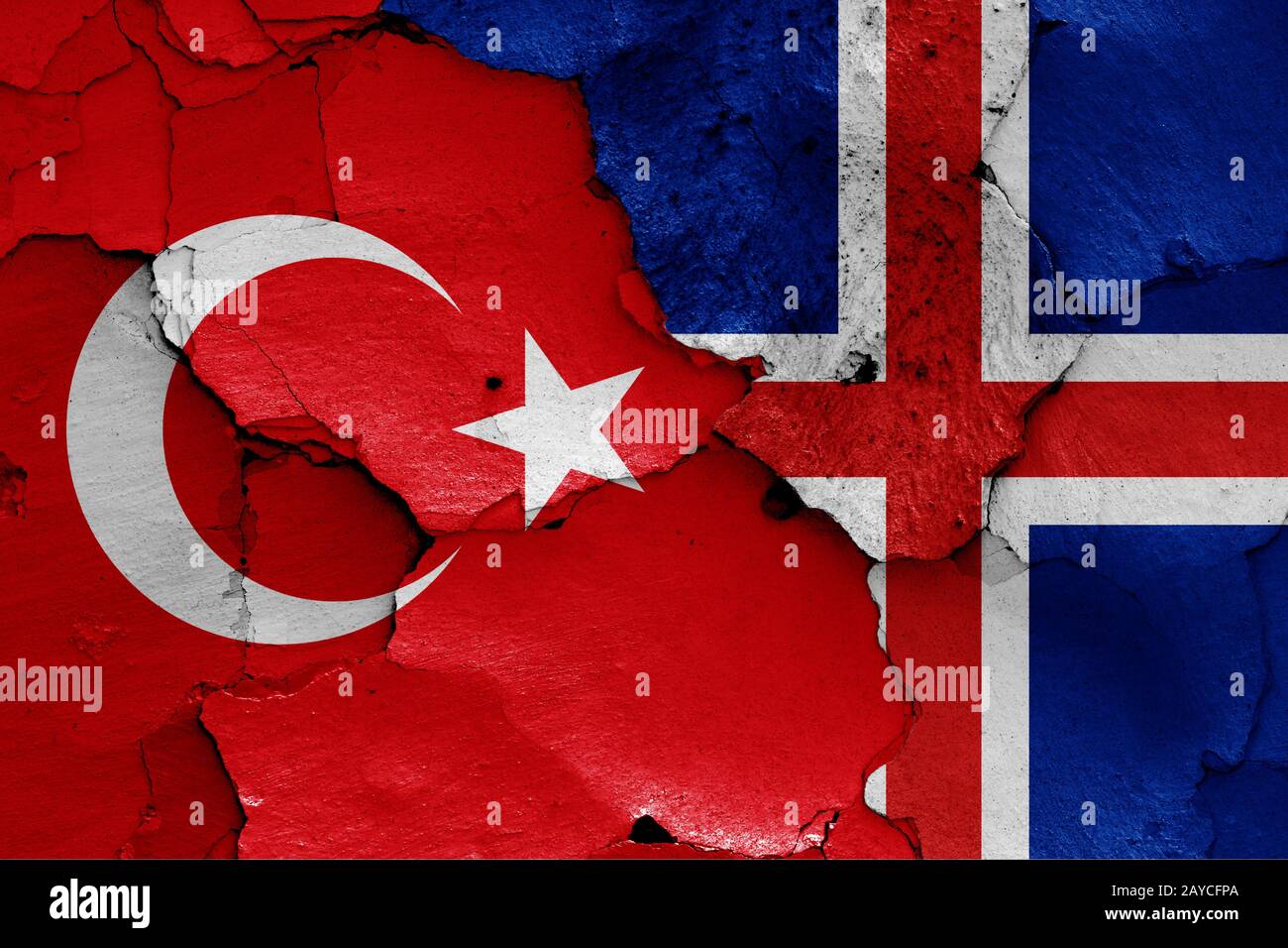 flags of Turkey and Iceland painted on cracked wall Stock Photo
