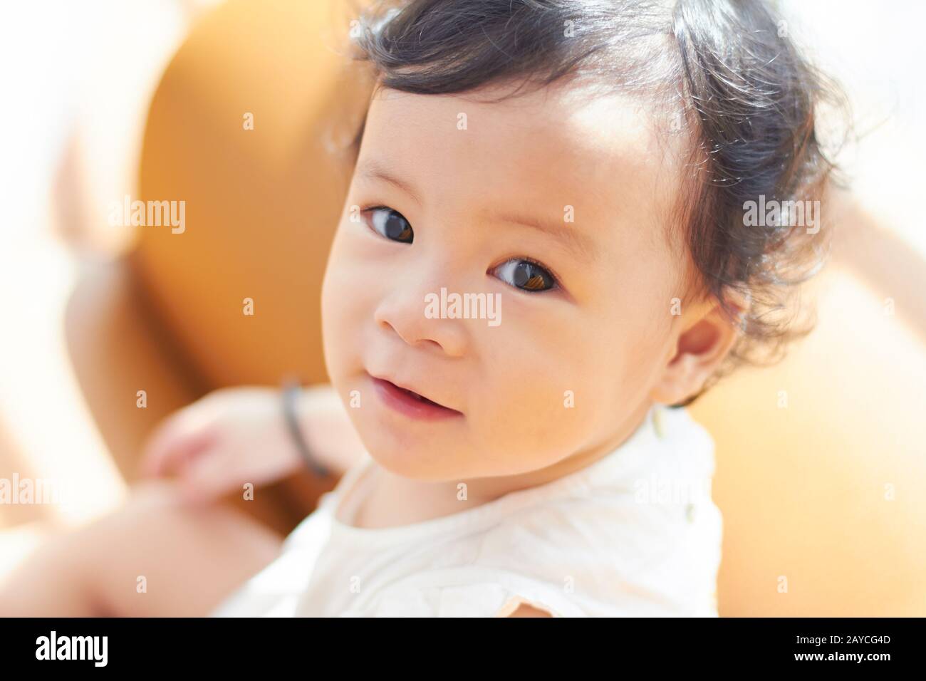 Portrait of cute and lovely curly hair asian chinese baby girl . Stock Photo