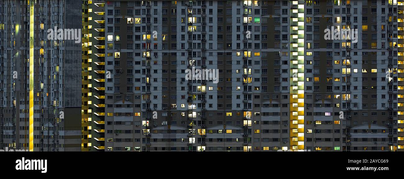 Modern apartment buildings on night  . Facade of a modern apartment building . Stock Photo
