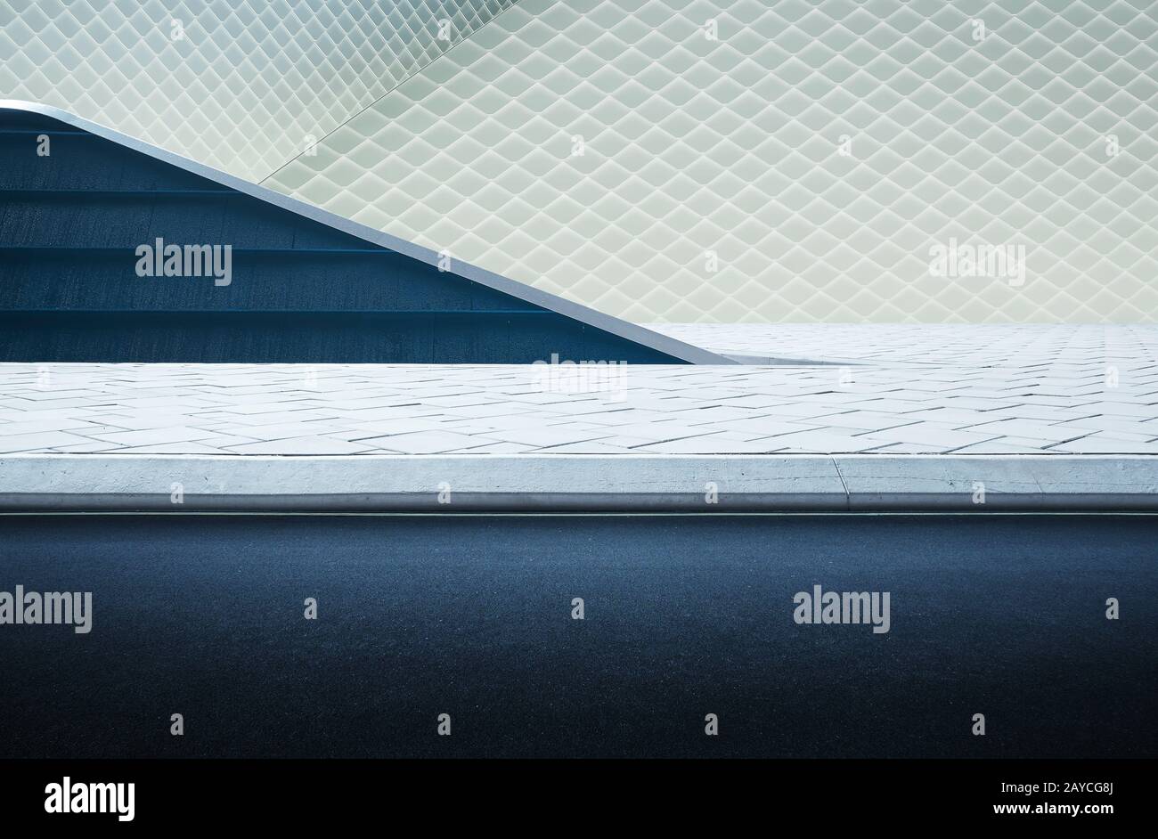 Abstract geometric structure blue and white wall and empty asphalt . Stock Photo