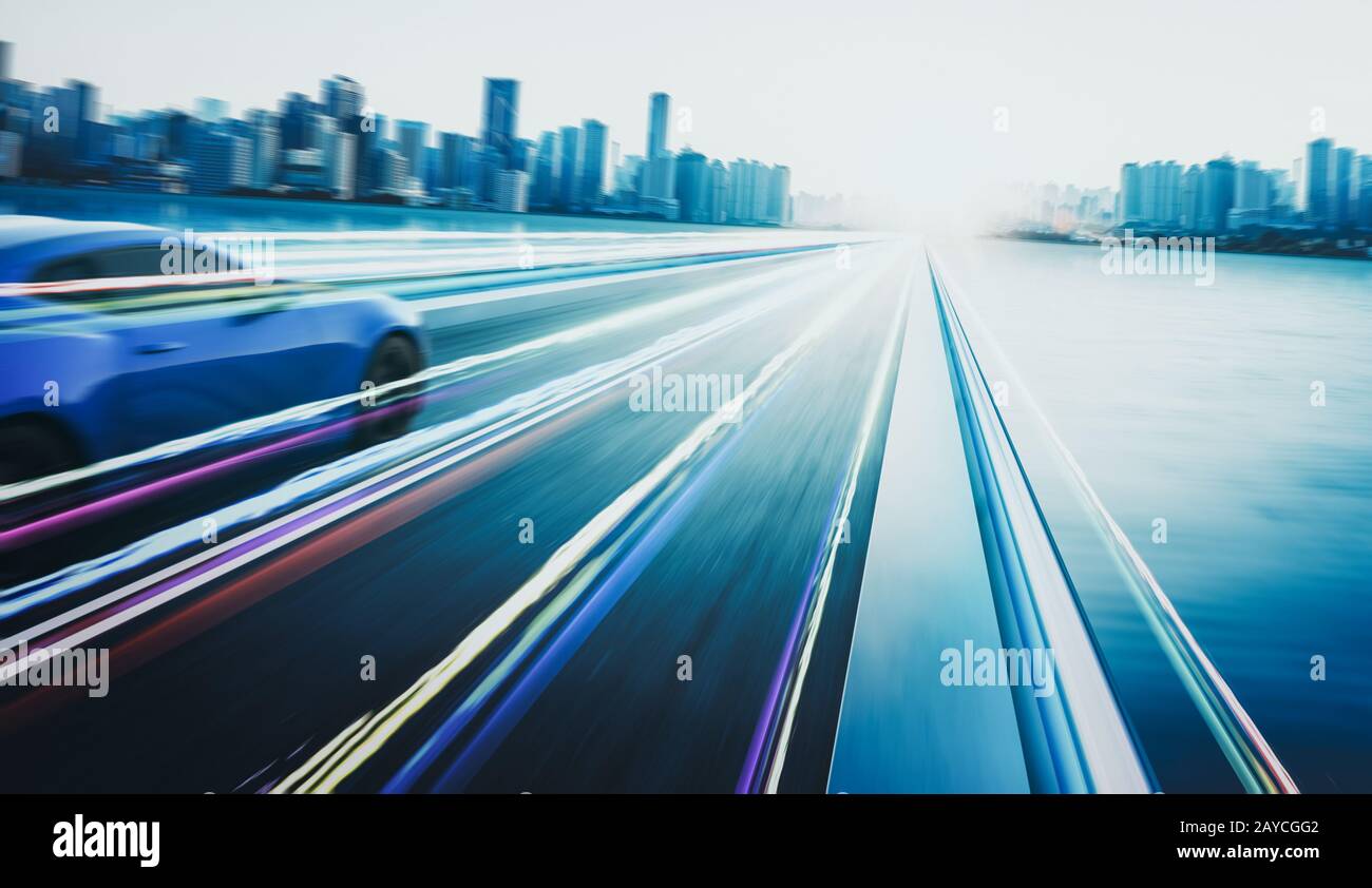 3D rendering of a brand-less blue sport car with light effect and motion blur . City skyline background . Sunset scene . Stock Photo