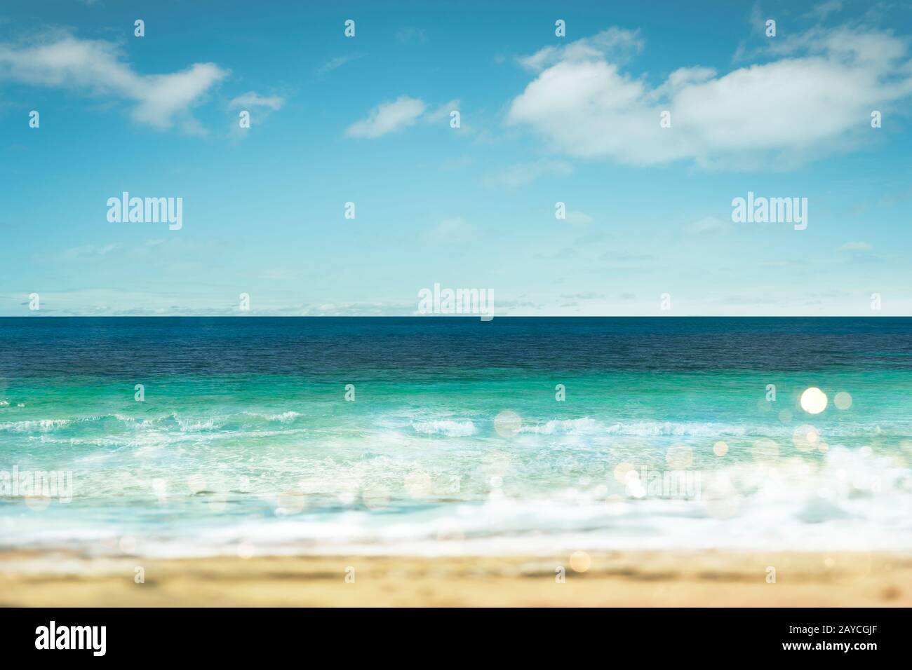 Tropical beach and sea with sunny sky . Bokeh soft effect . Stock Photo