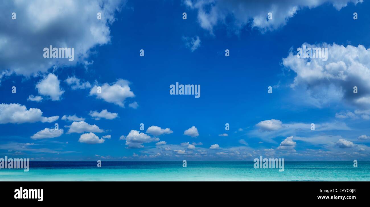 Beautiful sea and a blue sky with white clouds Stock Photo - Alamy