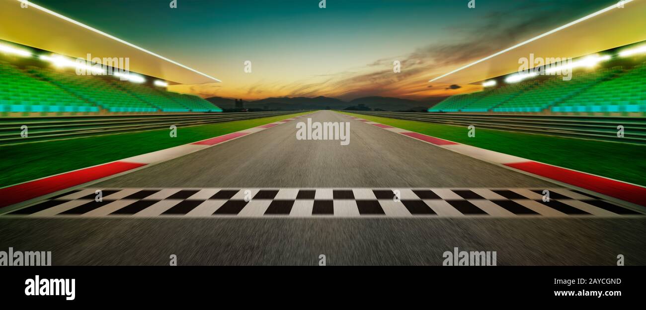 Motion blurred racetrack with start or end line . Horizontal format .Night scene . Stock Photo