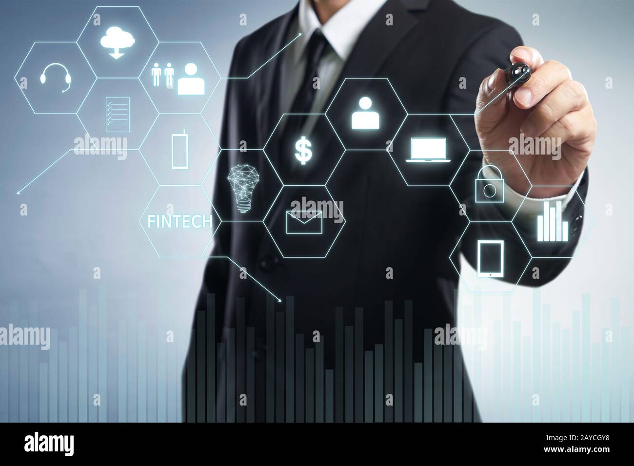 Businessman draw Fintech word on digital virtual screen . Hi-tech business concept . Stock Photo