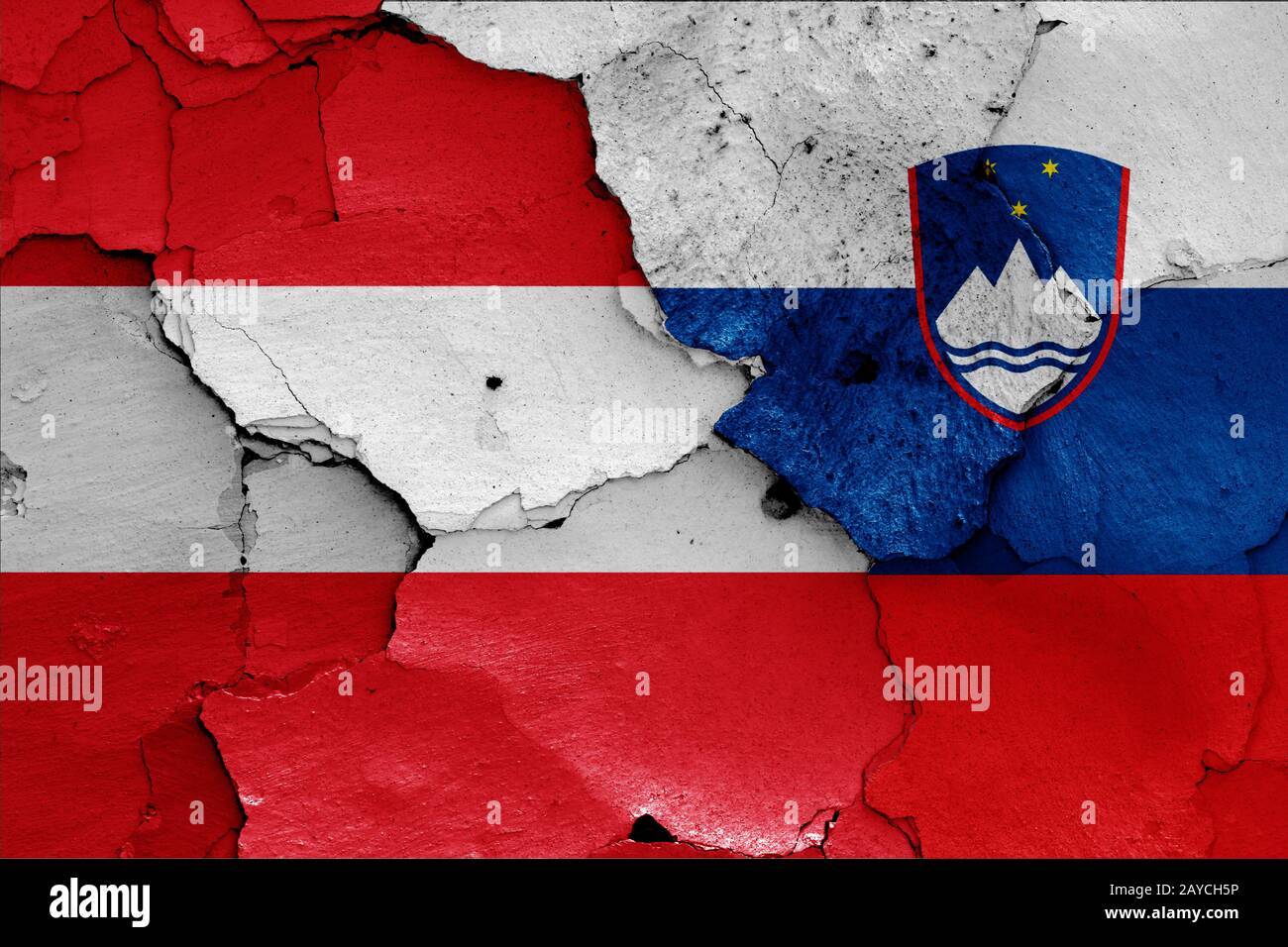 flags of Austria and Slovenia painted on cracked wall Stock Photo