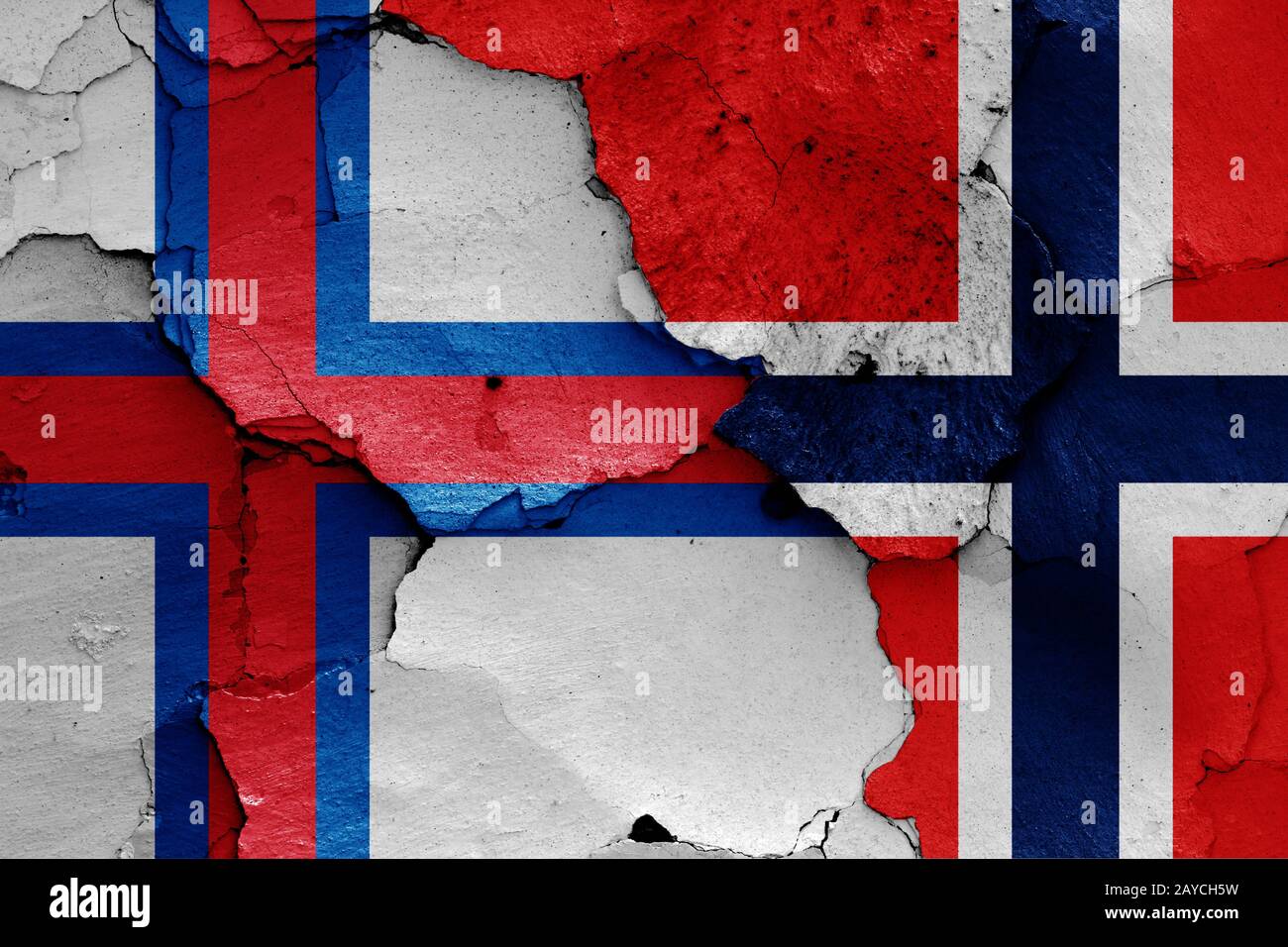 flags of Faroe Islands and Norway painted on cracked wall Stock Photo