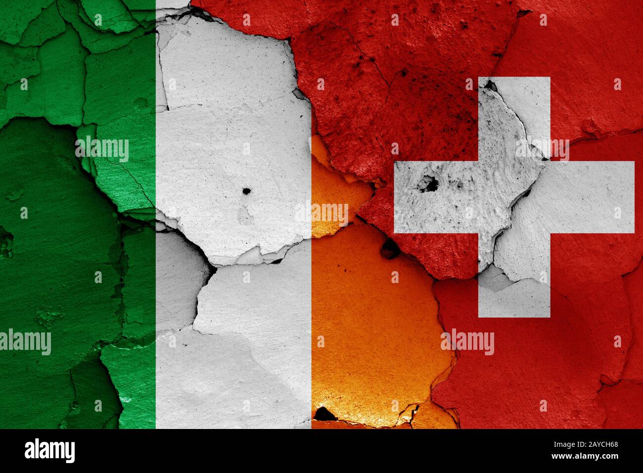 flags of Ireland and Switzerland painted on cracked wall Stock Photo ...