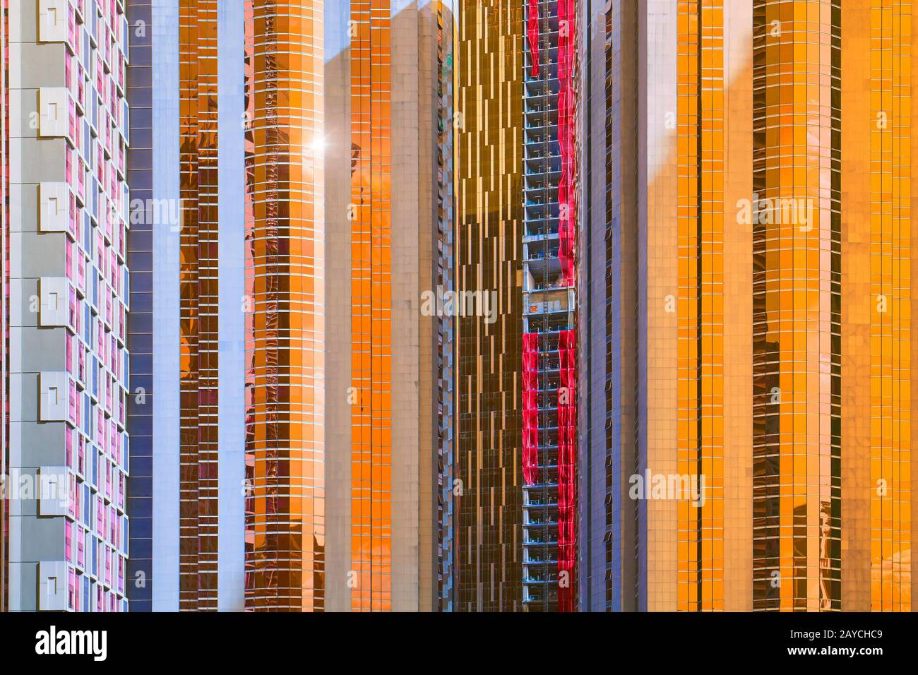 Urban abstract close up view of multiple steel and glass windows facade office building . Stock Photo