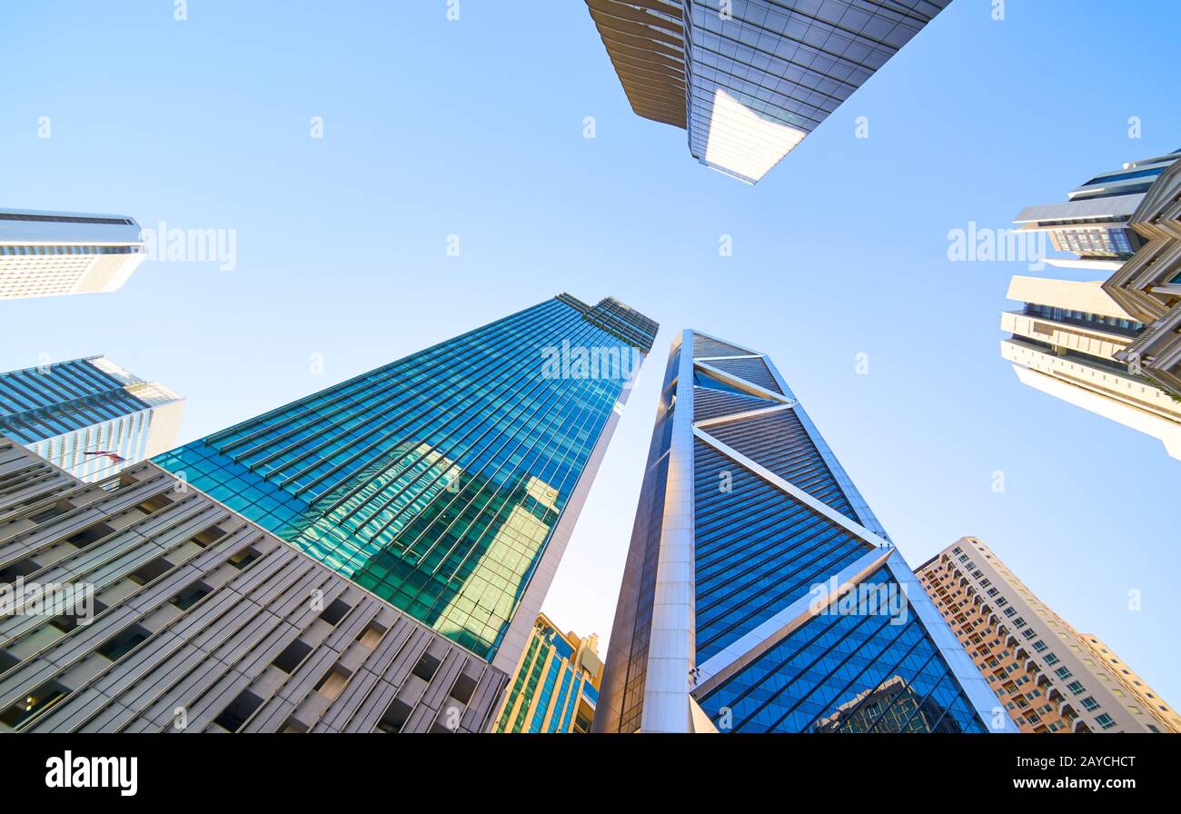 Low angle shot of modern glass city buildings with clear sky background. Kuala Lumpur Stock Photo