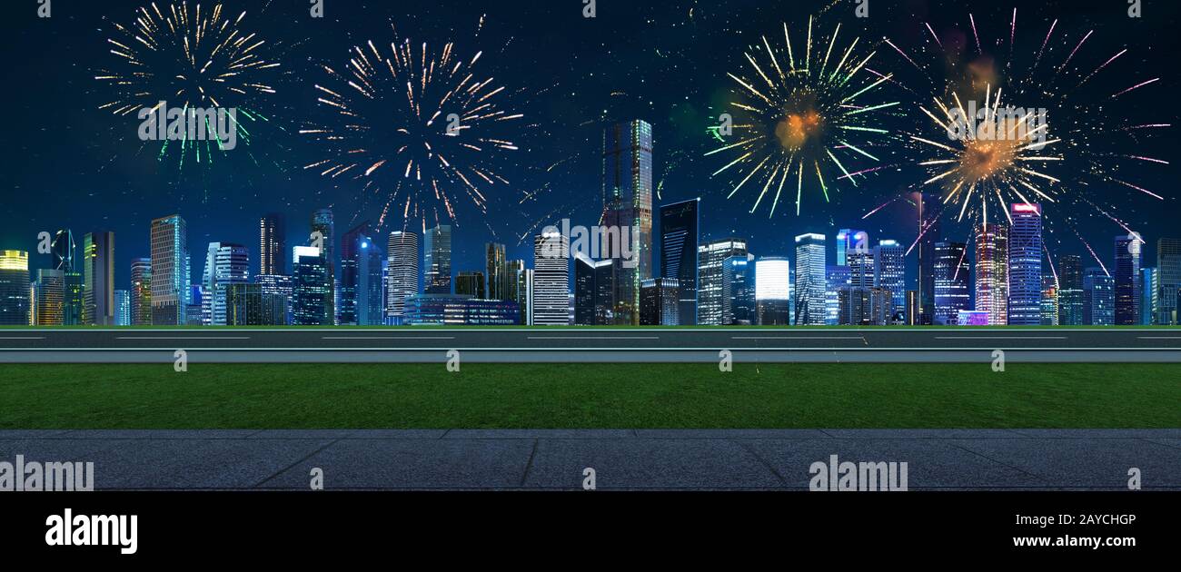 Side view asphalt road on night scene near the modern city with beautiful firework . Stock Photo