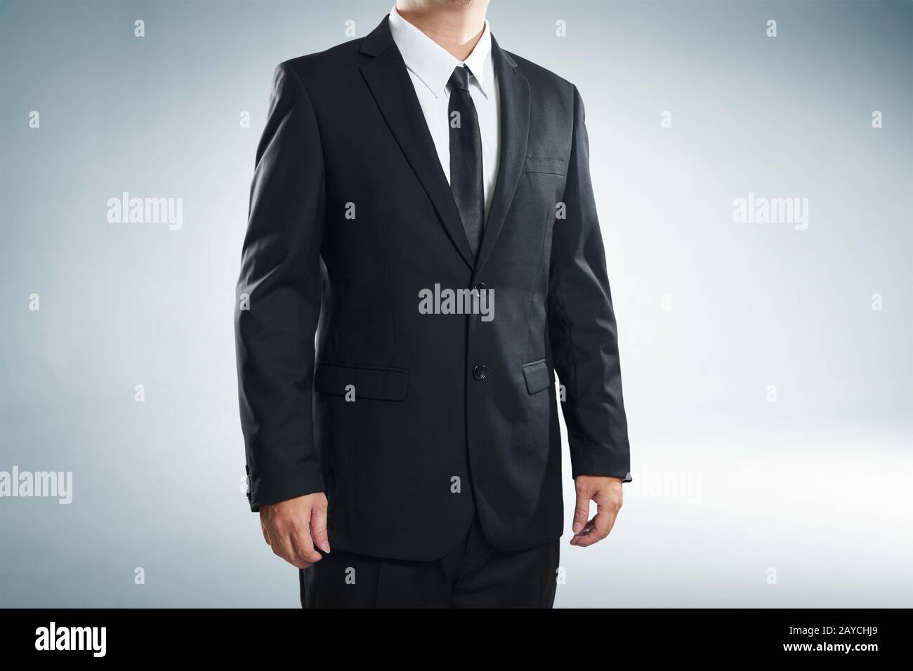 close up part of man body in black suit on white background Stock Photo