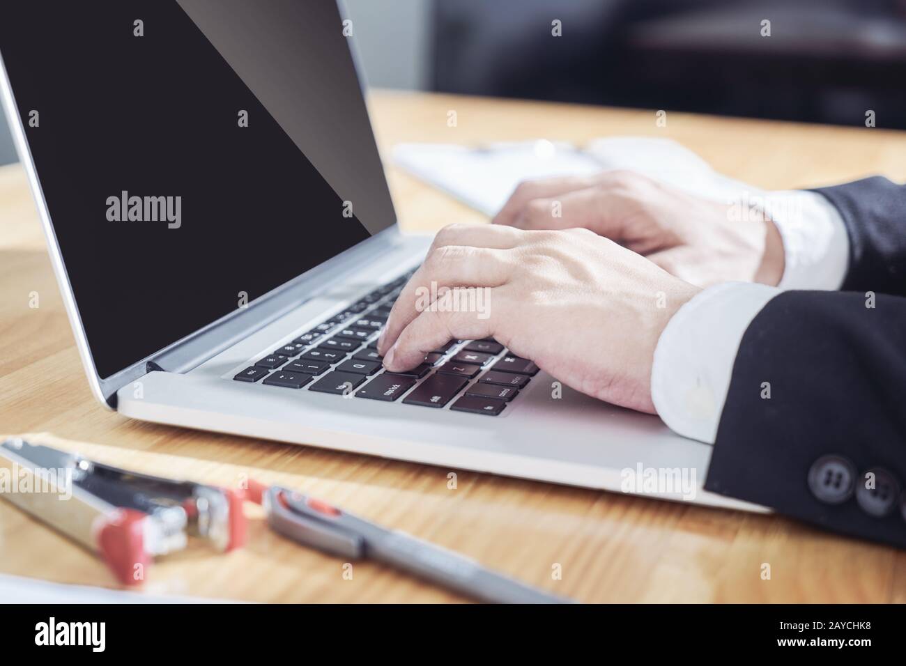 Businessman computer paperwork typing hi-res stock photography and ...